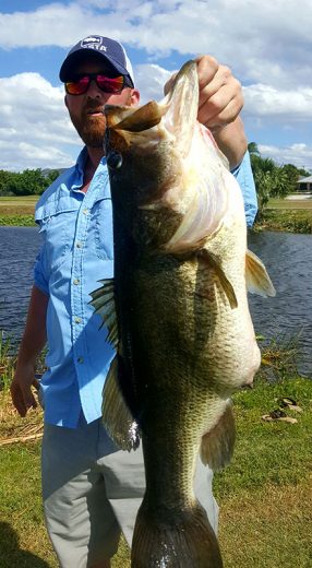 8 pound bass caught with south florida fishing and hunting outfitters