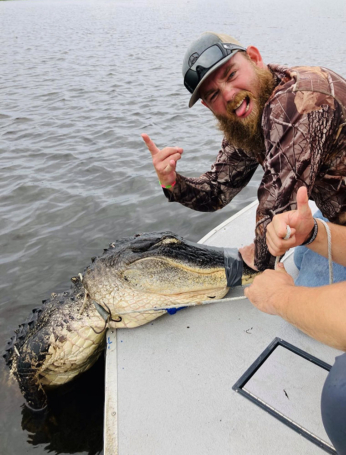 Captain Skeeter getting it done for a happy client on a Gator Hunting Trip
