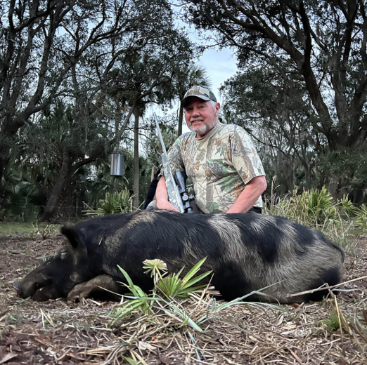 Happy Wild Boar Hunting Client in Okeechobee Florida